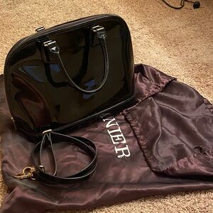 Danier Glossy Black Satchel
Patten leather with silk pouch for storing